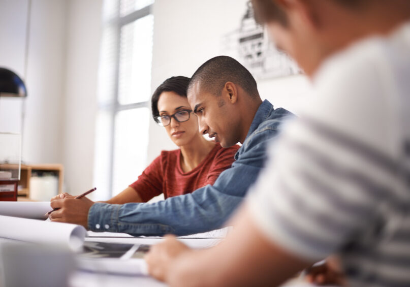 Shot of a group of young designers working together in an office